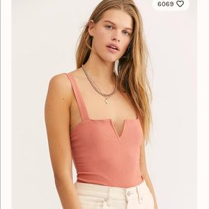 NWOT Free People bodysuit. Never worn. Size S